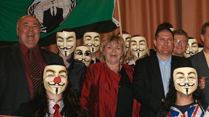 Marc Headley at a hate rally in Germany with other members of the cyber-terrorist group “Anonymous”